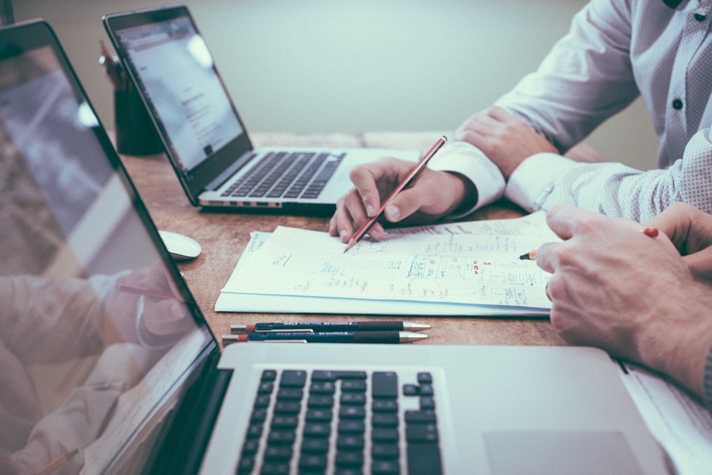 Business documents and laptop during an ERP planning session